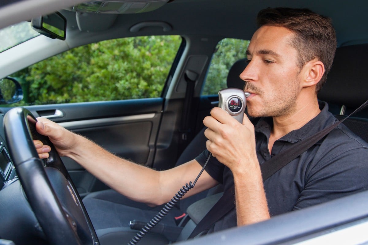 Person using breathalyzer